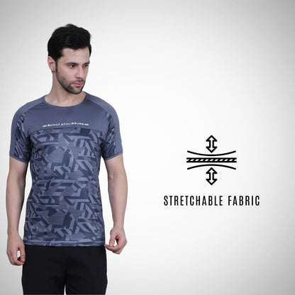 Man wearing a gray athletic shirt with geometric pattern, standing against a white background with 'Stretchable Fabric' text and logo.