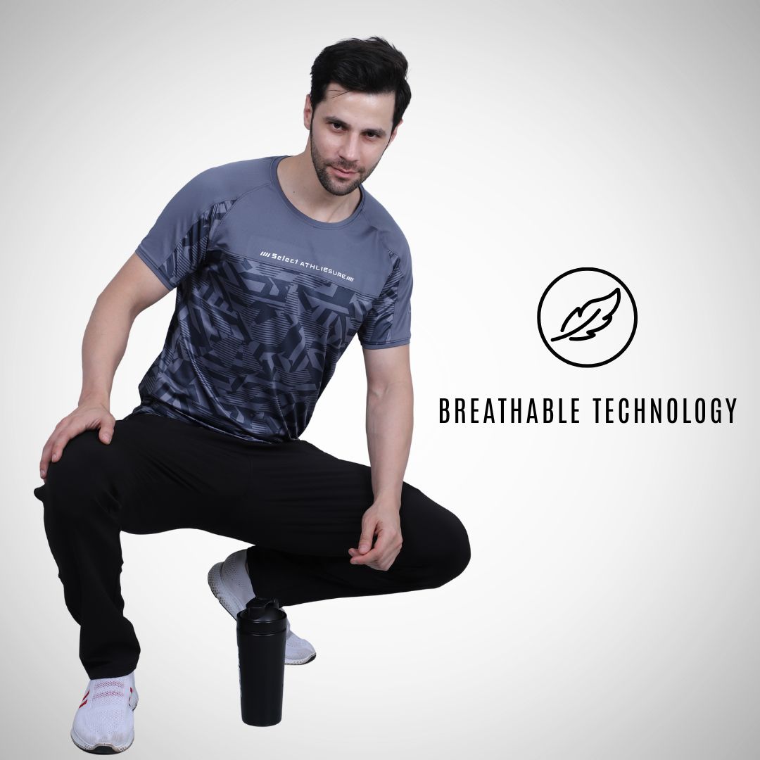 Man wearing a gray athletic shirt with breathable technology label on a white background