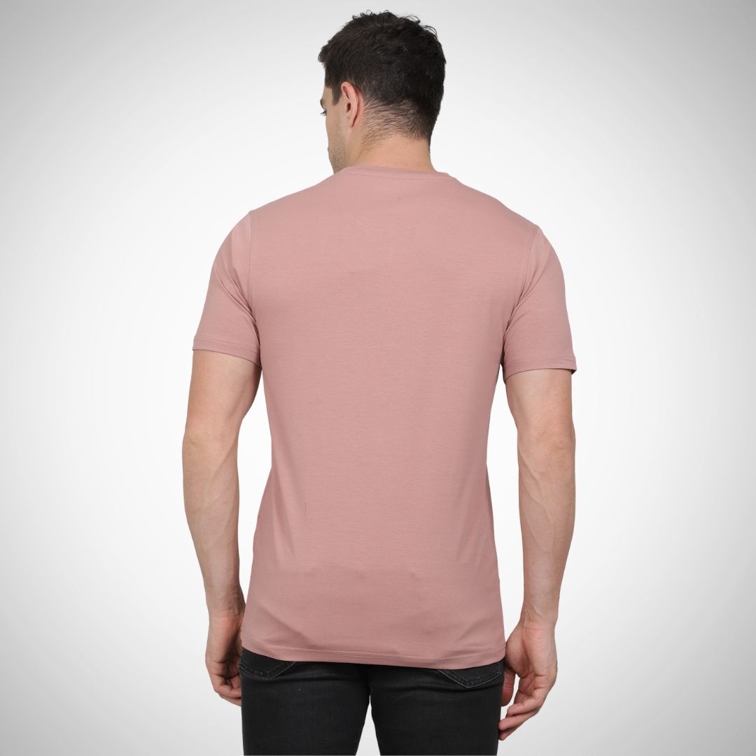 Man wearing a pink t-shirt on a white background