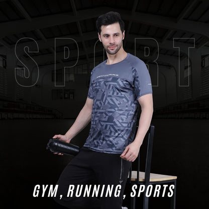 Man wearing a patterned t-shirt sitting on a bench with gym equipment in the background